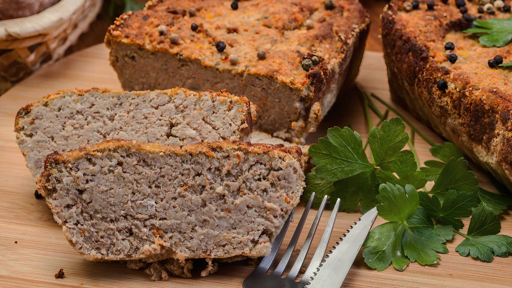 Meatloaf freshly baked from the oven for on a sandwich with Limburg mustard