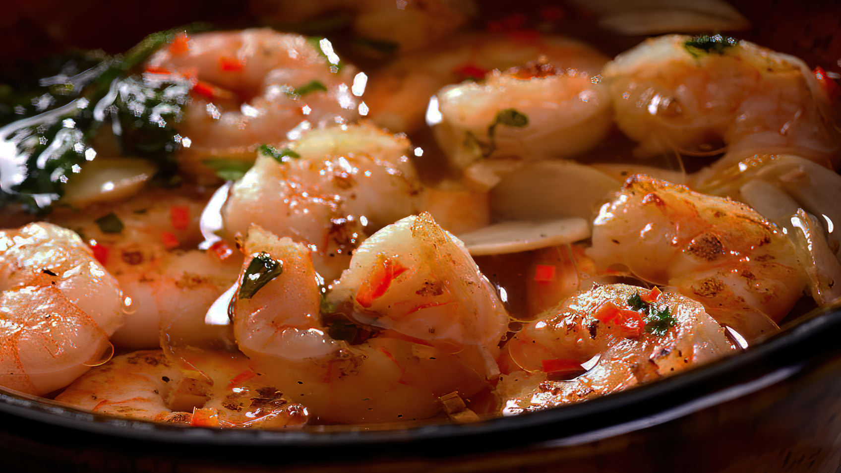 Scampi baked in herb butter with bread