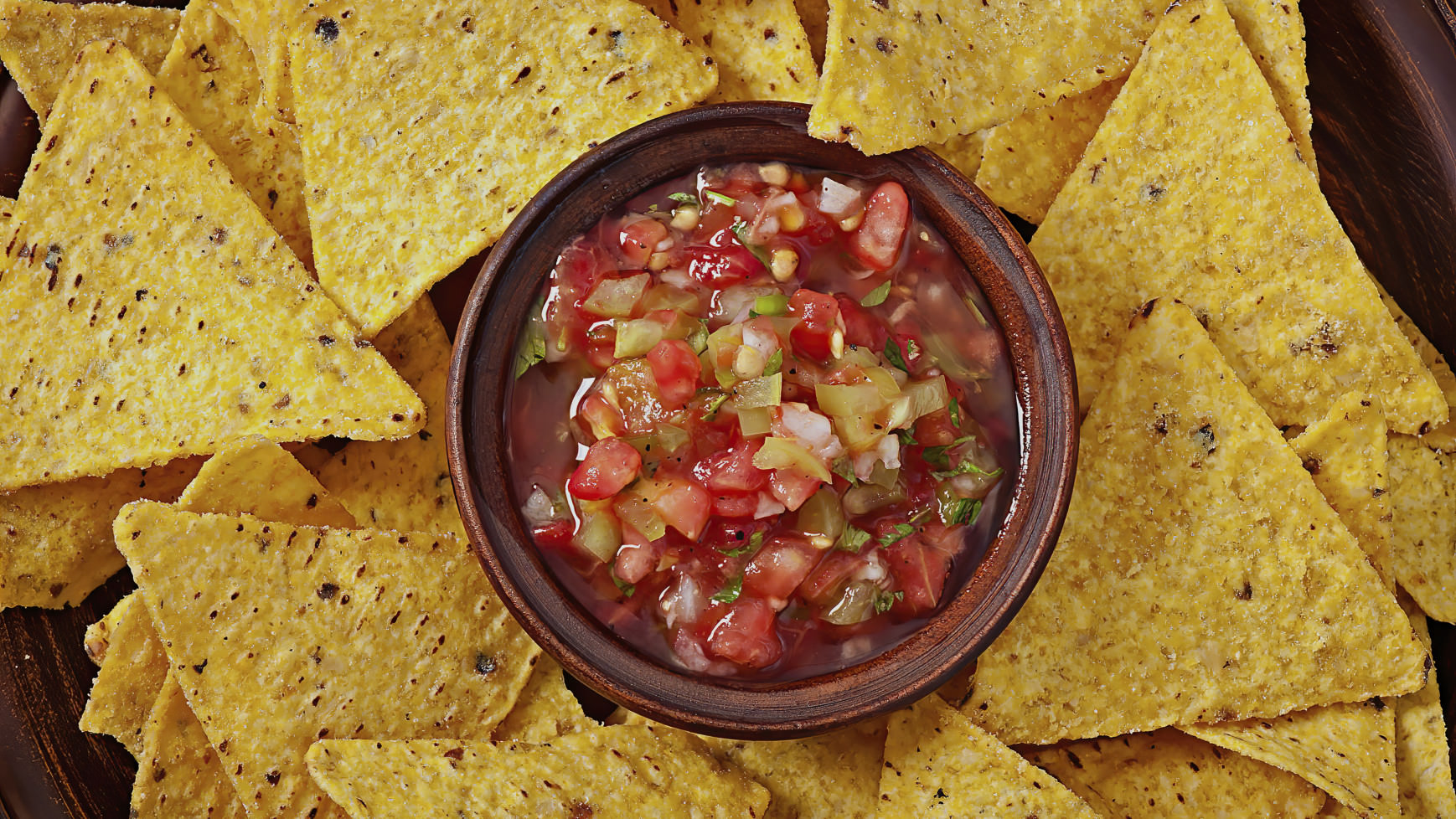 Mexican nachos with a nice salsa next to it