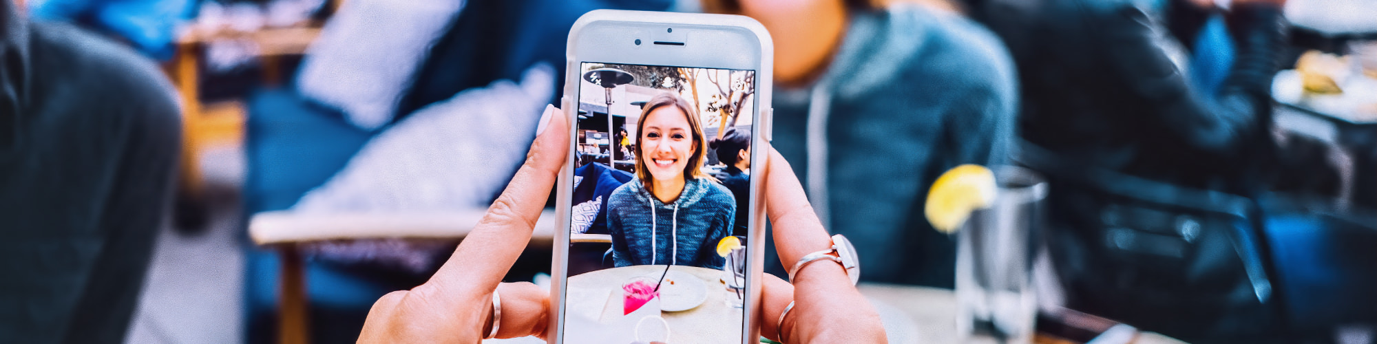 Woman with mobile phone takes picture on the silly Shepherd terrace
